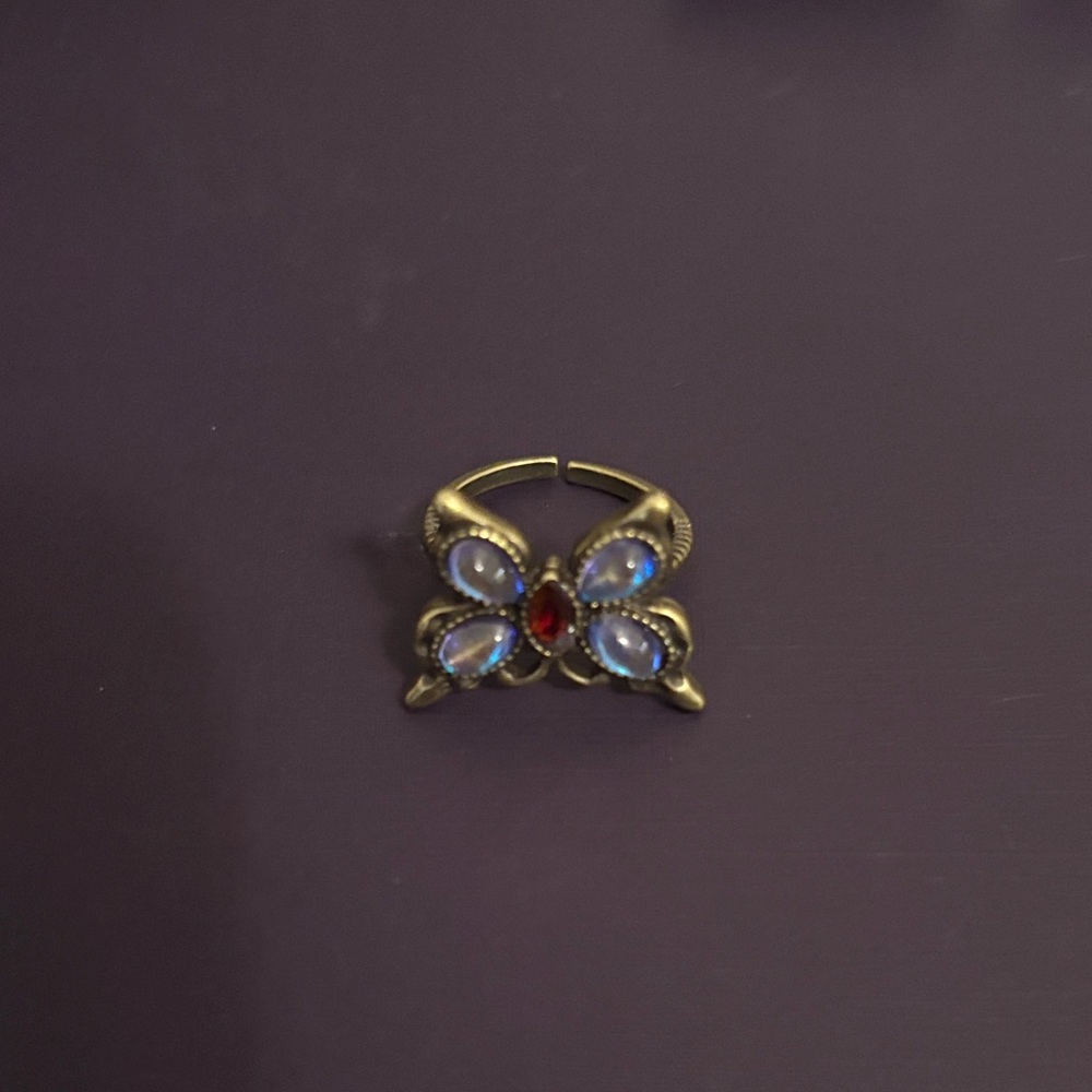 Elegant Gold Butterfly Ring with Red and Blue Accents